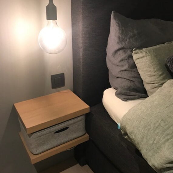 custom-made bin in use for the bed shelf