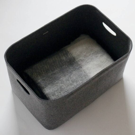 Custom-made bin in dark grey with blanket